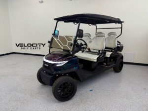 Green-Purple Chameleon Venom EV Strike 4-Passenger Golf Cart with touchscreen display, custom stitched seats, Apple CarPlay, and full suspension system