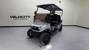 Venom EV Strike 4-passenger golf cart in Nardo Grey with all seats facing forward, shown in a non-lifted street-legal configuration.