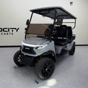 Venom EV Strike 4-passenger golf cart in Nardo Grey with all seats facing forward, shown in a non-lifted street-legal configuration.
